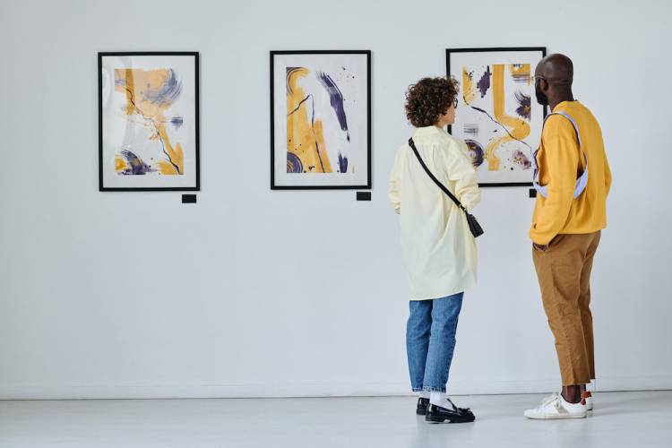 Couple looking at an art exhibit in a gallery