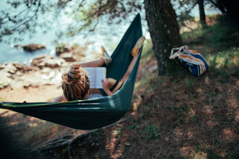 woman in hammock by lake 