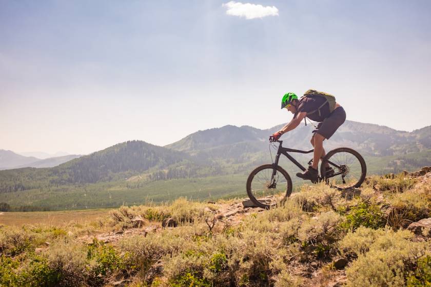man mountain biking in Utah